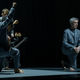 The cast of American Utopia kneels in a reference to Colin Kaepernick's "Star-Spangled Banner" protests